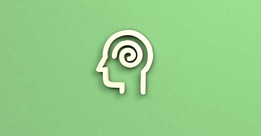 a 3d outline of a head with a 3d swirl in the middle of the head. The background is a light green.