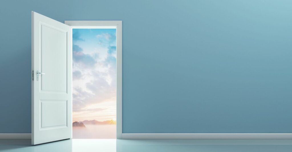 A graphic of an open white wooden door and in the doorway shows a pastel sky with white and blue clouds and some vague scenery of mountains.